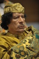 Муаммар Каддафи.U.S. Navy, photo by Jesse B. Awalt